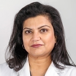 Headshot of Mrinalini Kulkarni-Date.